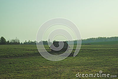 Old wooden house in the countryside. the house stands alone in the field Stock Photo