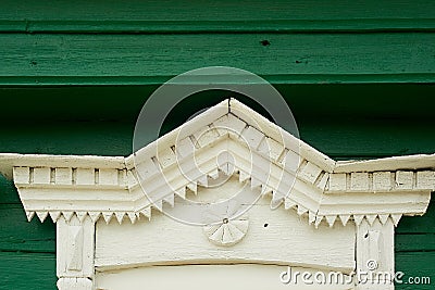 An old wooden house in a Russian village.Fragment of the tiles on the window. Historic building. Stock Photo