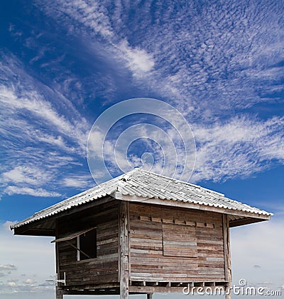 Old wooden hut with clouds float. Stock Photo