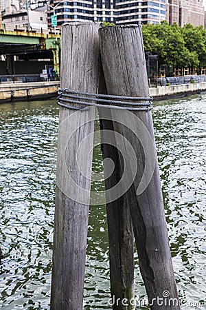 Old wooden pillar on a jetty in New York City, USA Stock Photo