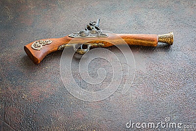 Old vintage wooden pistol on wooden background Stock Photo