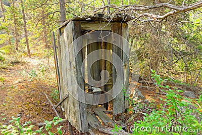 An old wooden privy at a mining camp in the yukon Stock Photo