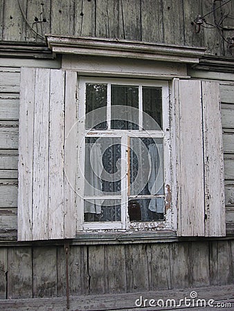 Old wooden rural house with an open window, historical monument Stock Photo