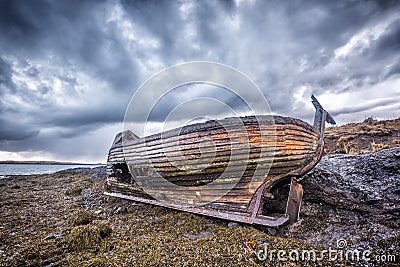 Old wooden ship on beach Stock Photo