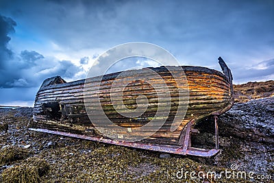 Old wooden ship on beach Stock Photo
