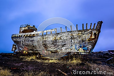 Old wooden ship on beach Stock Photo