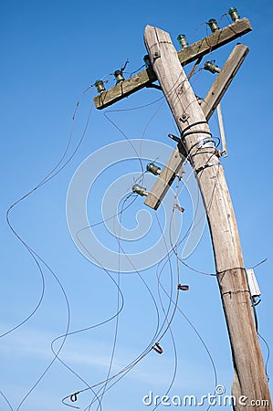 Old wooden telephone pole Stock Photo
