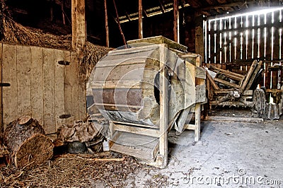 Old wooden threshing machine Stock Photo