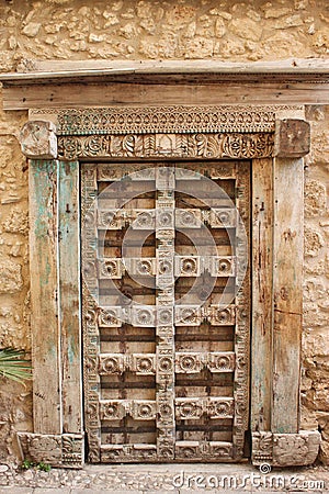 Old wooden venetian decorative door Stock Photo