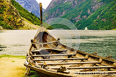 Old viking boat and ferryboat on fjord, Norway Stock Photo