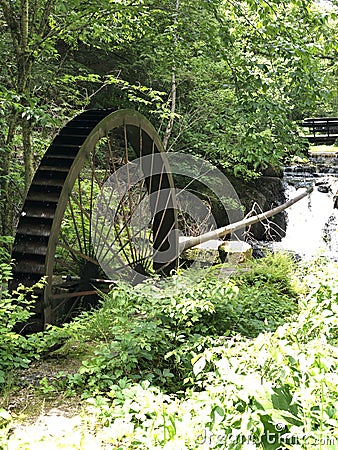 Old water wheel on river Stock Photo