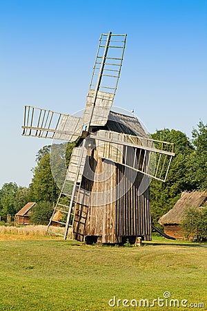 Old wooden windmill in the countryside Stock Photo