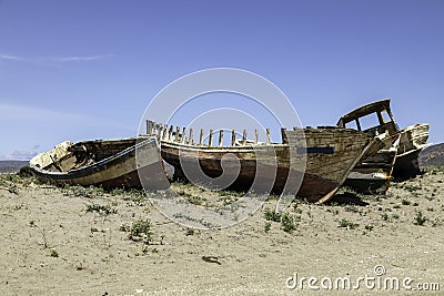 old wooden worn fishing boats abandoned on the beach of Cabo de Gata, Almeria, Spain. Stock Photo