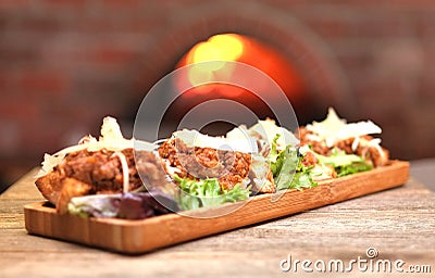 Old world Italian bruschetta topped with meat sauce and cheese Stock Photo