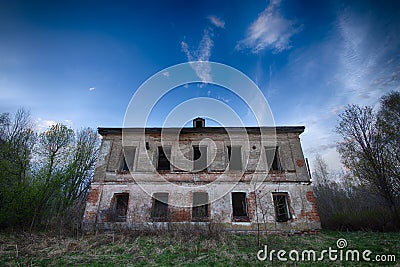 Old, worn, abandoned collapsing building Stock Photo