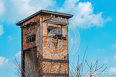 Old worn abandoned electricity cabin transformer tower made of bricks Stock Photo