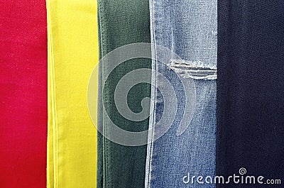 Old worn jeans 5 different colors, jeans background, the background of clothing, torn jeans Stock Photo