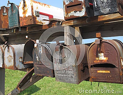 Old worn mail boxes Stock Photo