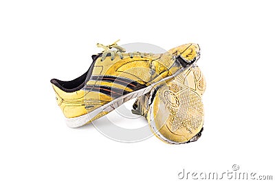 Old worn out futsal sports shoes on white background soccer sportware object isolated Stock Photo