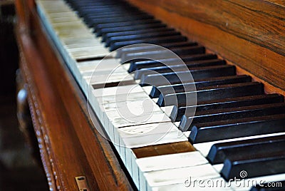 Old worn out piano close up of missing keys Stock Photo