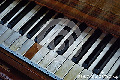 Old worn out piano close up of missing keys Stock Photo