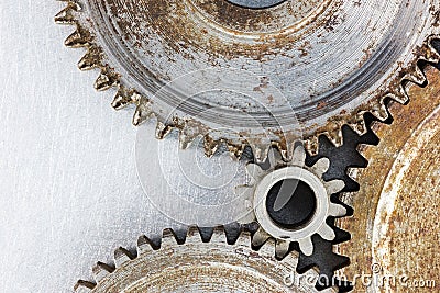 Old worn out rusty cogwheels on industrial background Stock Photo