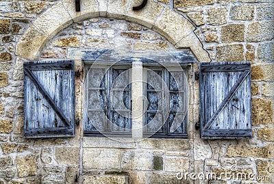 An Old, Worn Window in Turenne, France Stock Photo