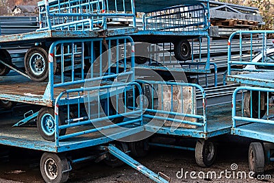 Old written-off blue metal trolleys in a pile dump Stock Photo