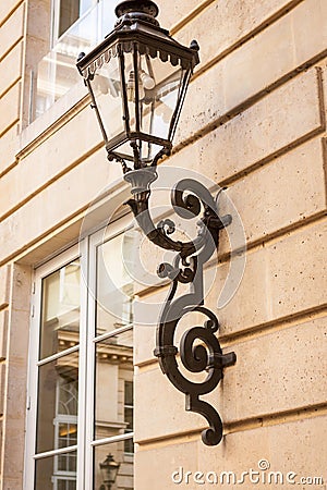 Old wrought iron lamp on a building exterior Stock Photo