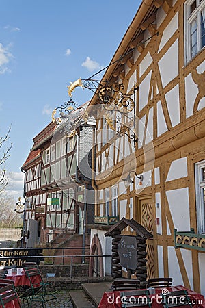 Old wrought iron sign on a half timbered house Editorial Stock Photo