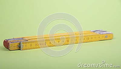 old yellow folding rule with centimeter measurement Stock Photo