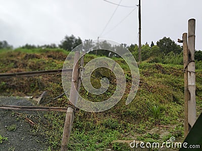 Olden style gate for the villagers to avoid wild animals to enter ther field with wooden fencing and clean enviroment Stock Photo