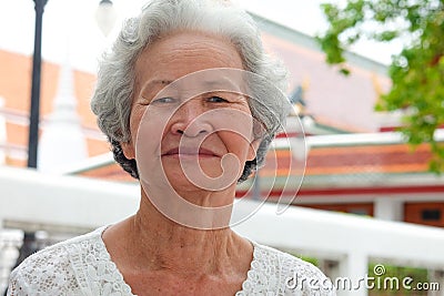 Older Asian women with grayish hair have smiling faces Stock Photo