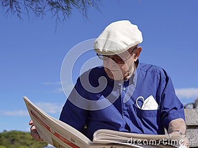 An older gentleman looking the news Stock Photo