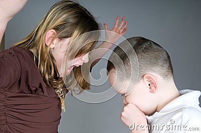 Older girl yelling at boy Stock Photo