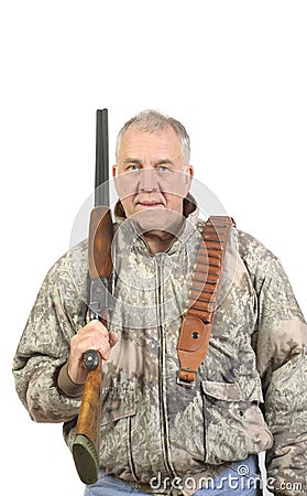 Older hunter in camo with shotgun Stock Photo