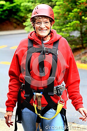 Older Lady Wearing Zipline Gear Stock Photo