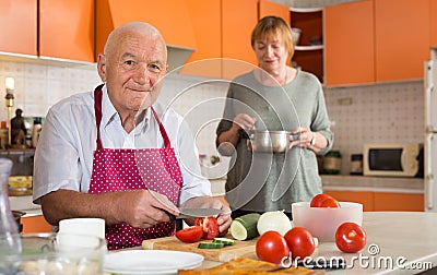Older male and female making eating Stock Photo