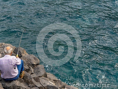 Older man fishing. Editorial Stock Photo