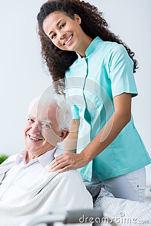 Older man and his carer Stock Photo