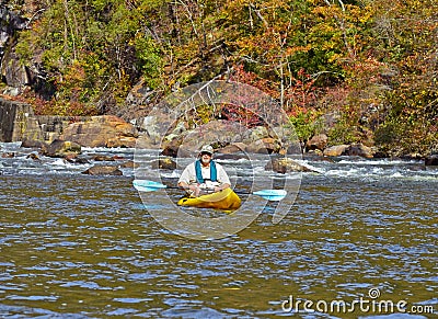 Older Man Kayaking in Autumn Stock Photo