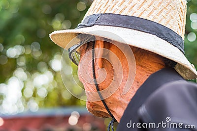 An older man wearing a white hat prepare to farm. Editorial Stock Photo