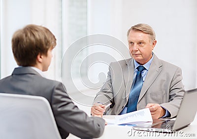 Older man and young man having meeting in office Stock Photo