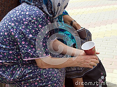 Older people collect alms Editorial Stock Photo