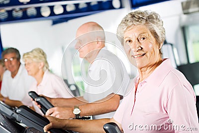 Older people exercising in the gym Stock Photo