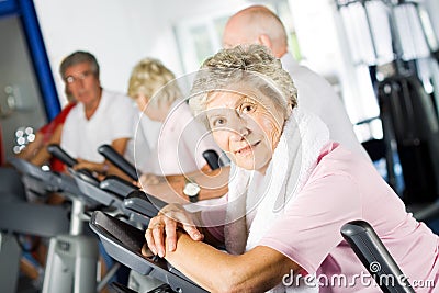 Older people exercising in the gym Stock Photo