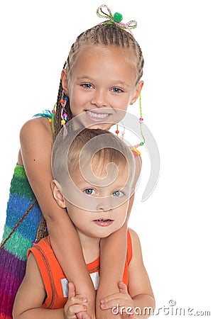 Older sister hugging a sibling Stock Photo