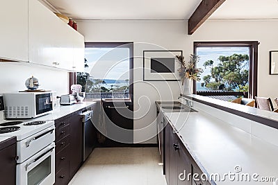 Older style retro 70s kitchen in Australian beach house Stock Photo