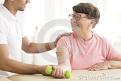 Older woman in physical rehabilitation Stock Photo