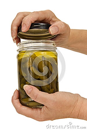 Older Woman's Hands Opening Glass Jar Stock Photo